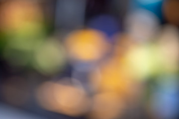 .Blurred background with colorful circles with dominant red, yellow, orange and green tones.