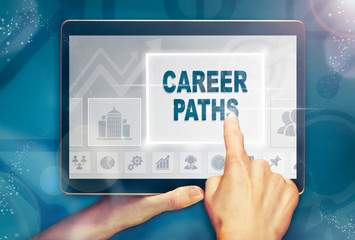 A hand holiding a computer tablet and pressing a career paths business concept.