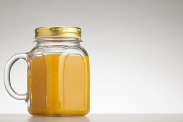 orange smoothie in jar