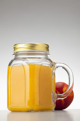 peach or nectarine juice in closed jar