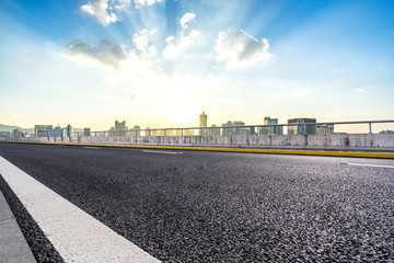 city skyline with asphalt road in urban