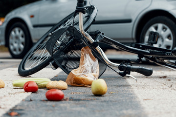 Low angle on fruits and bike after car accident with drunk driver