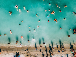 Aerial Summer View Of Clear Ocean Water Full Of Tourists