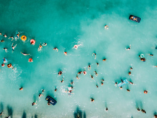 Aerial Summer View Of Clear Ocean Water Full Of Tourists