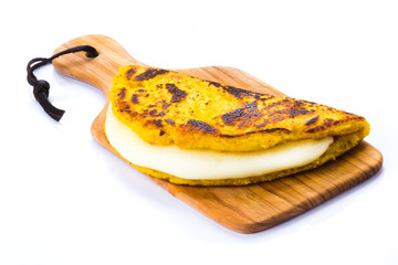 Cachapa with cheese, Typical Venezuelan cuisine made of ground corn and white cheese, white background