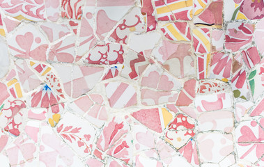 Tile mosaics fragment of "Serpentine Bench" in Park Guell in Barcelona. These mosaics are called Trencadis (chopped), and means using pieces of old tile, glass and broken chinaware to create patterns.