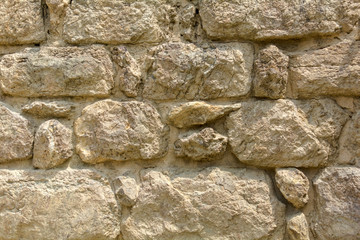 Texture of brown stone wall background. The image of old stone wall for use as a background. Old brick stone wall background.