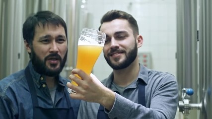 Two male coworkers smiling