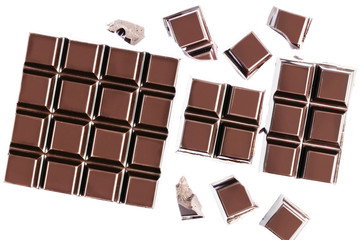 Chocolate cubes, pieces of bitter, dark chocolate bar, isolated on white background, top view