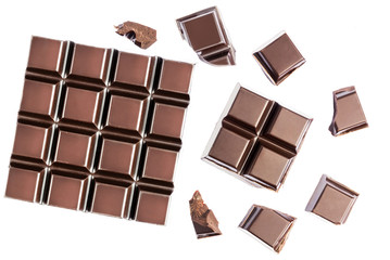 Chocolate cubes, pieces of bitter, dark chocolate bar, isolated on white background, top view
