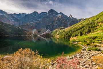 Wonderful sunrise at lake in the Tatras in autumn, Poland © shaiith