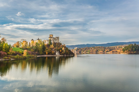 Beautiful castle by the lake at sunset in autumn, Poland
