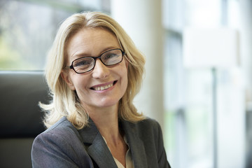 Close-up of businesswoman smiling