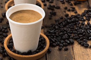 coffee in paper cup on wood
