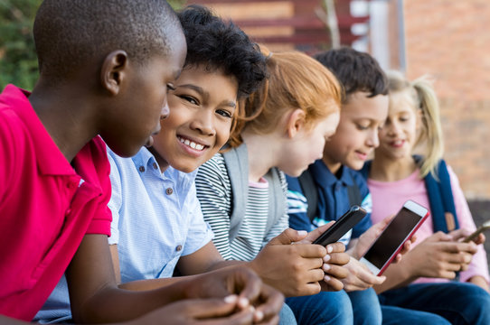 School Children Using Phones