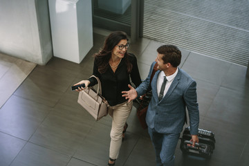 Business colleagues arriving at conference