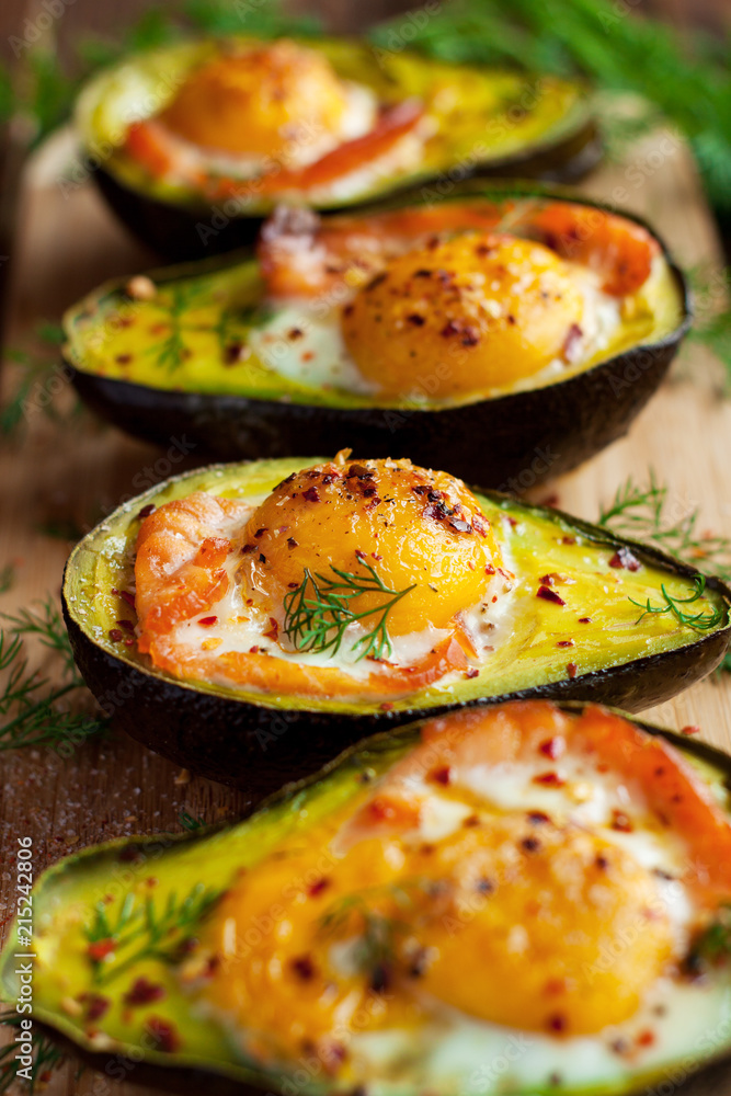 Wall mural Baked eggs in avocado with smoked salmon