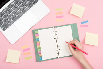 notebook on pink background