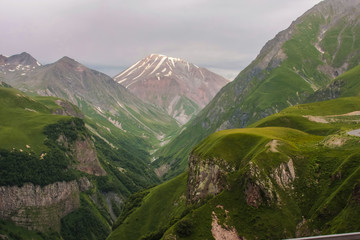 green georgian mountains and volcano