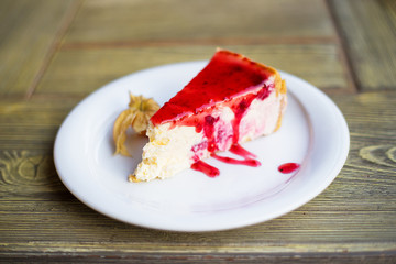 Delicious and beautiful cheesecake with strawberry jam