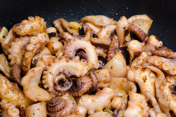 Close up of tasty plate of cooked octopus with paprika and olive oil
