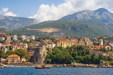 Fototapeta na wymiar Summer Mediterranean landscape. Montenegro. View of coastal town of Herceg Novi located at the foot of Mount Orjen