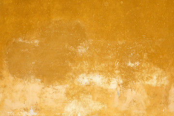 Yellow old faded wall texture background in Italy