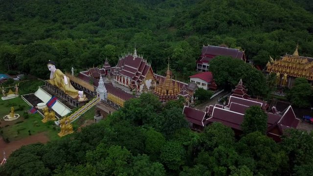 Aerial View of Buddhist Temple Wat Phra That Suthon Mongkon Khiri features beautiful architectures that are inspired by the ancient, traditional ordination hall (Ubosot) and reclining Buddha statue