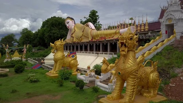 Aerial View of Buddhist Temple Wat Phra That Suthon Mongkon Khiri features beautiful architectures that are inspired by the ancient, traditional ordination hall (Ubosot) and reclining Buddha statue