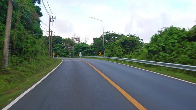 camera is moving along the road. driving on roads by car or motorcycle.