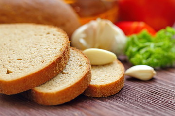 Variety of organic food including vegetables, spices, oil and bread