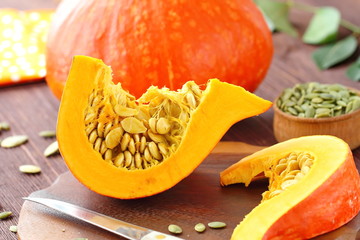 Sliced pumpkin on a wooden table