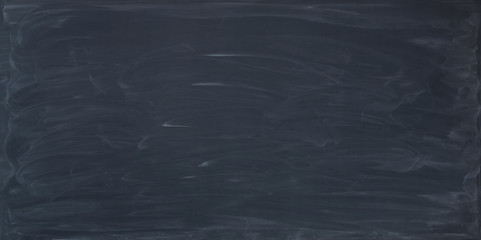 School clear blackboard abstract background, with chalk sponge marks.