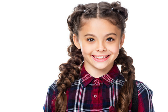 portrait of smiling schoolchild looking at camera isolated on white