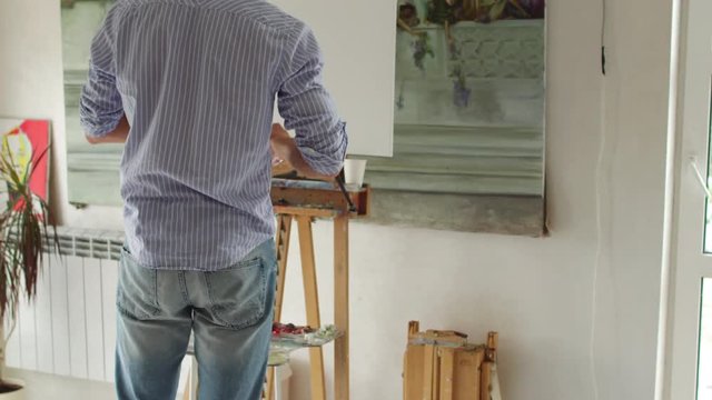 painter preparing to paint picture