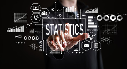 Statistics with businessman on a black background 