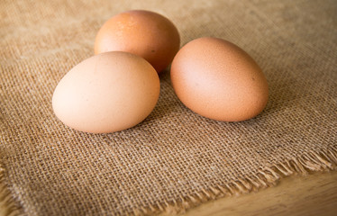 Three eggs on burlap