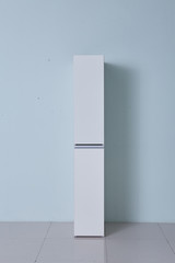 White storage stand with ceramic and dishware in kitchen. modern kitchen furniture. japanese modern Kitchen storage furniture. Dining Room.