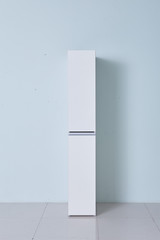 White storage stand with ceramic and dishware in kitchen. modern kitchen furniture. japanese modern Kitchen storage furniture. Dining Room.