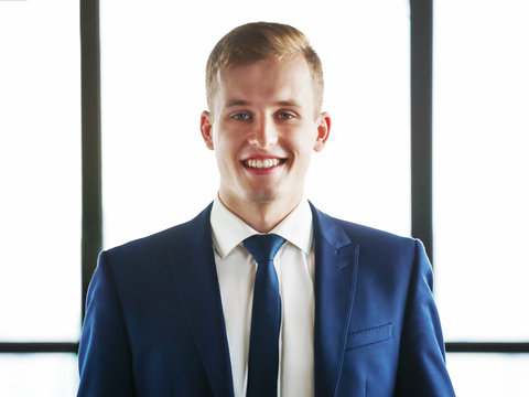 Portrait of young handsome business man.