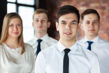 Portrait of young business people looking at camera.