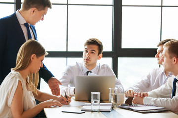 Group of young business people working in office.