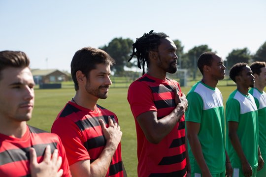 Players paying tribute to the country before the game