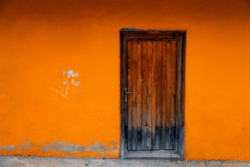 Orange wall background and door