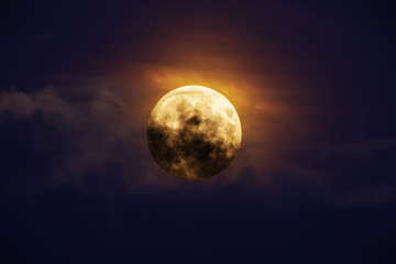 Naklejka na ściany i meble Bright full moon against dark clouds vibrant colors