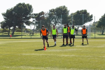 Players running through cones