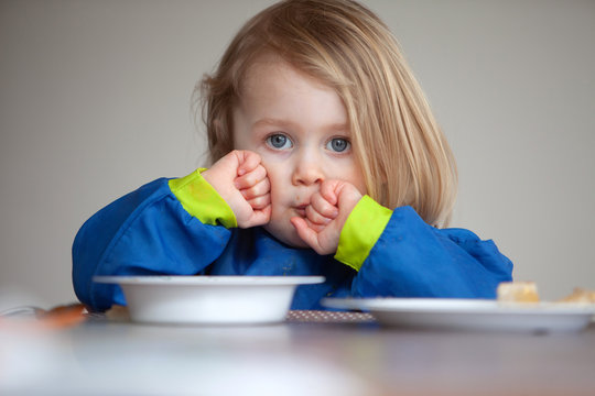 Toddler Eating Tomato Soup For Lunch