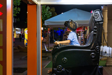 a little boy is immersed in virtual reality with the help of glasses
