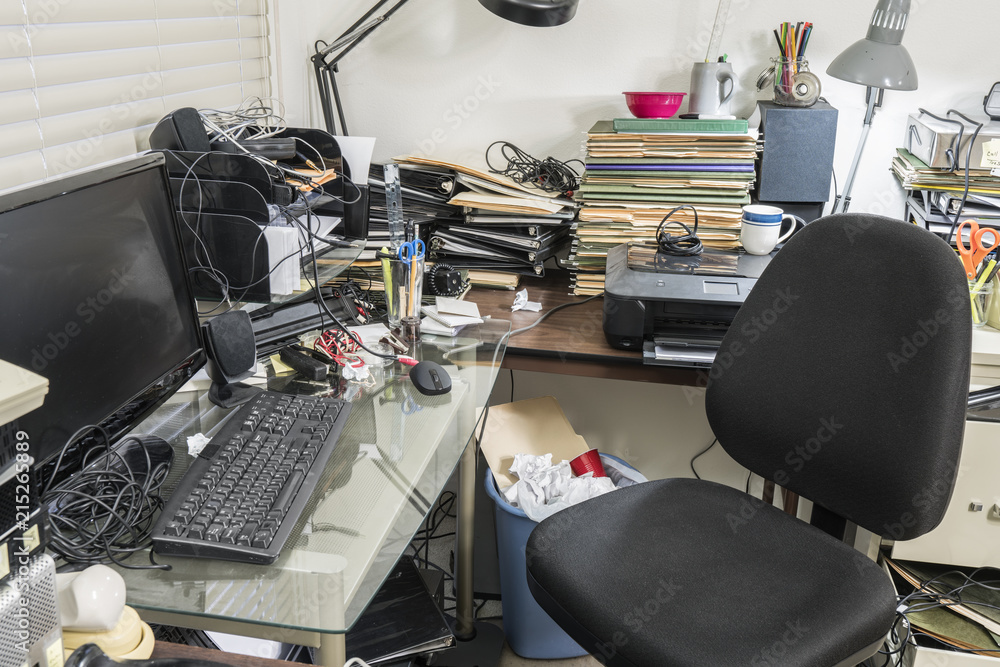 Wall mural messy office with clutter filed desk, piles of file folders and notebooks.