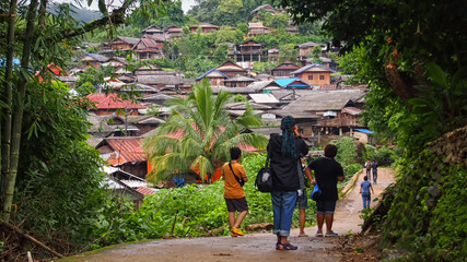 A Group of Tourists in A Village of Lua or Lawa Hill Tribe Ethnic Group As Community Based Tourism Activity.